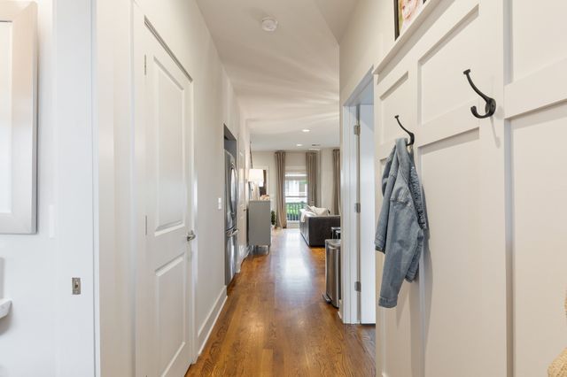 a view of a hallway with a white walls