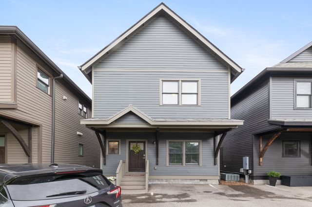 a view of a house with wooden deck