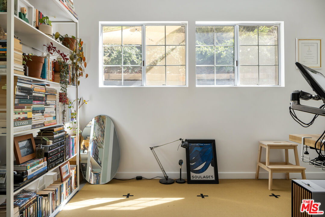 7815 Denivelle Road Sunland, CA 91040 - Photo 12 of 25 a view of a room with gym equipment and a window