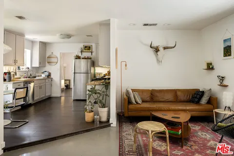 a living room with furniture and a area