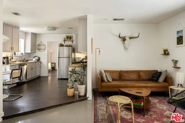 a living room with furniture and a area