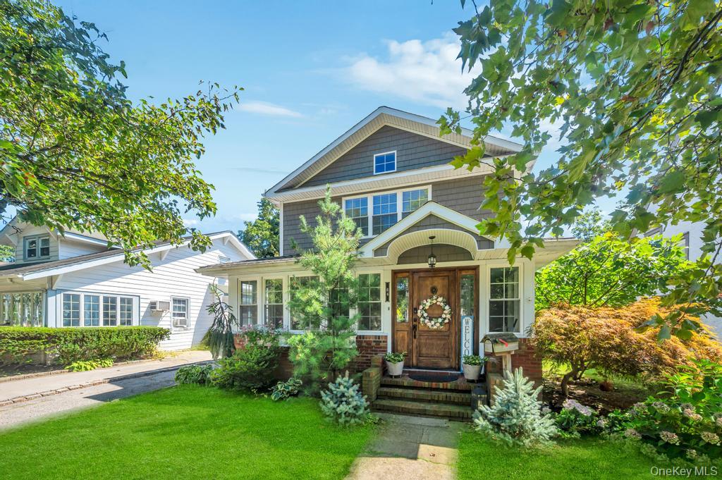 84 Superior Road Floral Park, NY 11001 - Photo 1 of 1 a front view of a house with a garden