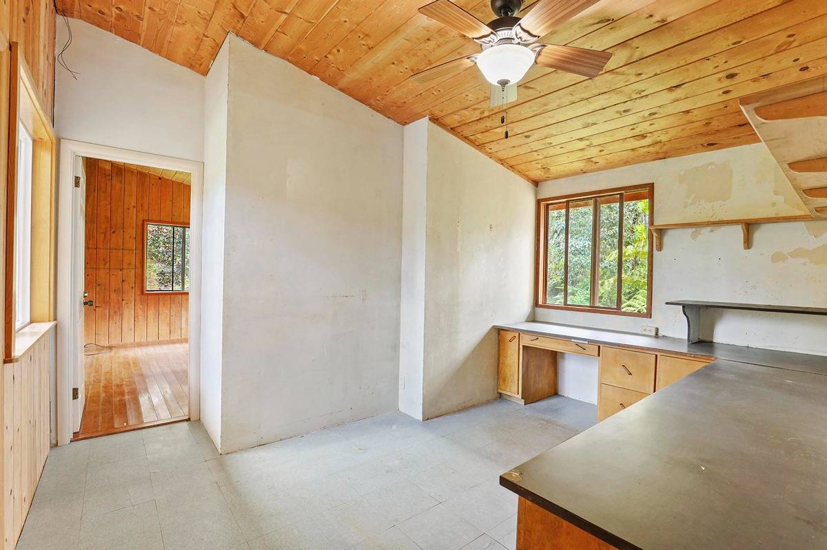 16-1585 Hopue Road, Unit 2 Mountain View, HI 96771 - Photo 12 of 29 a view of a kitchen with a sink and dishwasher