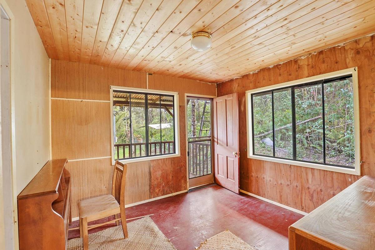 16-1585 Hopue Road, Unit 2 Mountain View, HI 96771 - Photo 18 of 29 a view of an empty room with a window