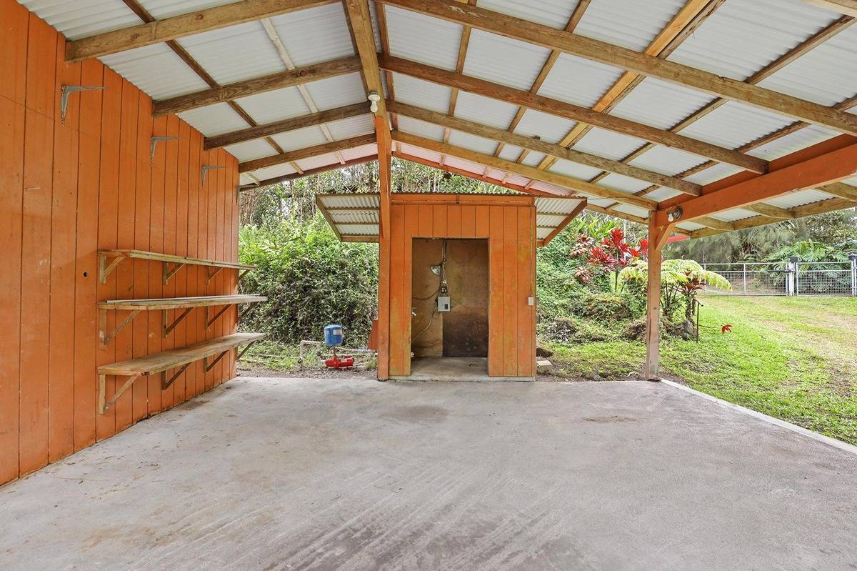 16-1585 Hopue Road, Unit 2 Mountain View, HI 96771 - Photo 20 of 29 a view of a room with stairs and a big yard