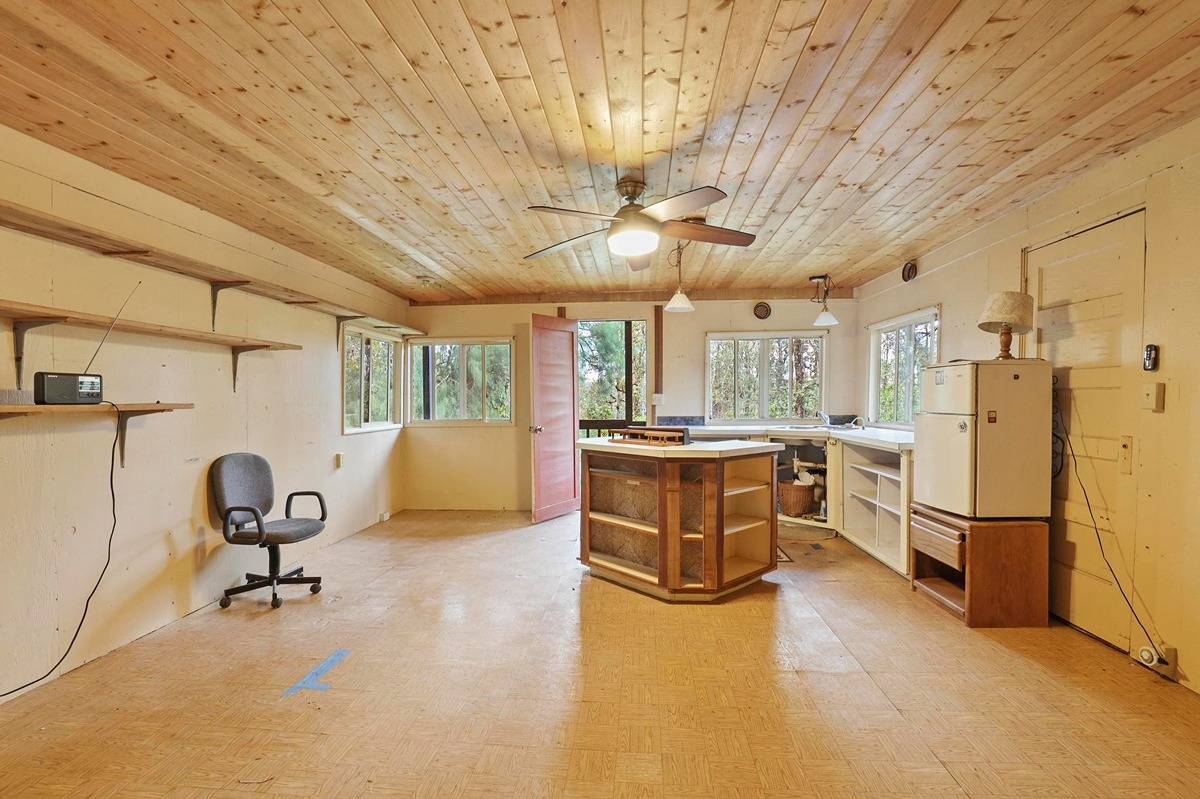 16-1585 Hopue Road, Unit 2 Mountain View, HI 96771 - Photo 21 of 29 a view of a kitchen with refrigerator and window