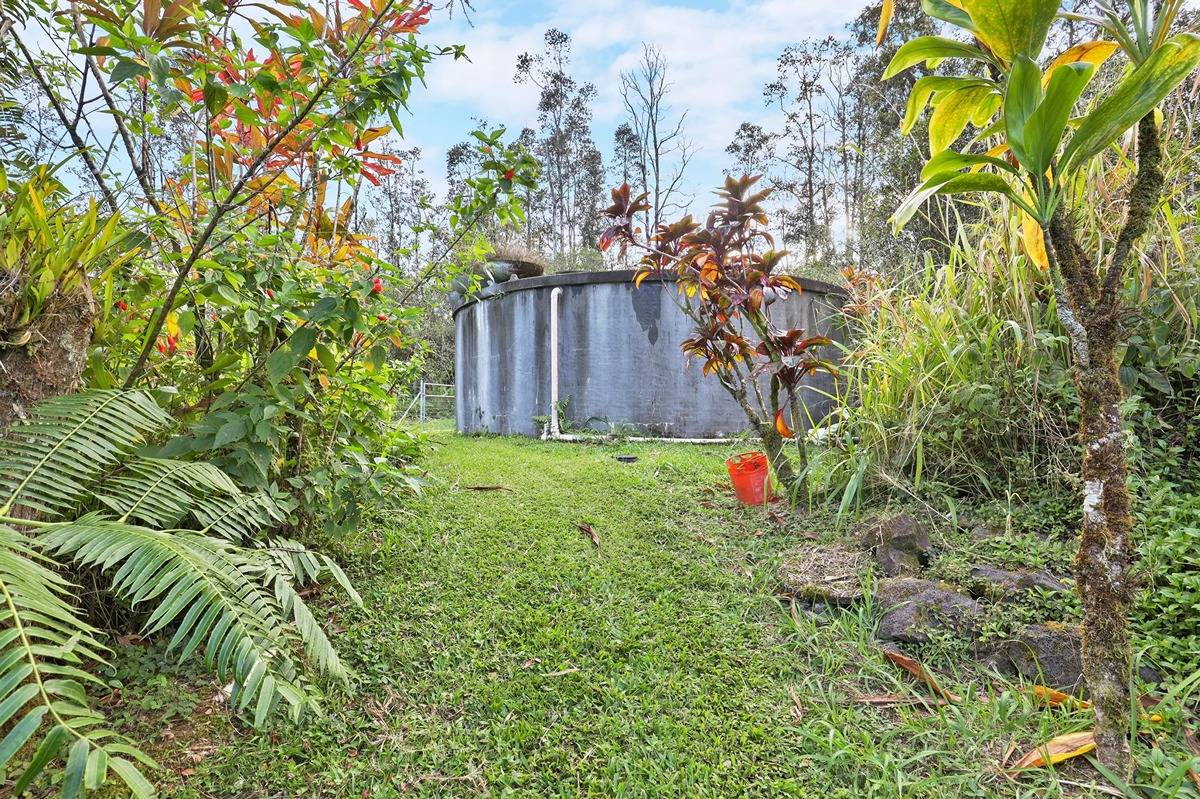 16-1585 Hopue Road, Unit 2 Mountain View, HI 96771 - Photo 27 of 29 a backyard of a house with lots of green space
