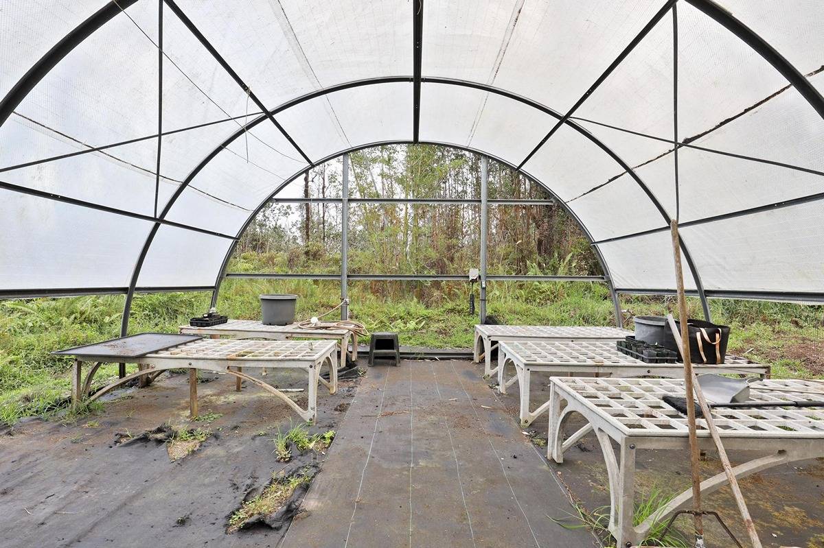 16-1585 Hopue Road, Unit 2 Mountain View, HI 96771 - Photo 29 of 29 a view of an outdoor sitting area with a fountain