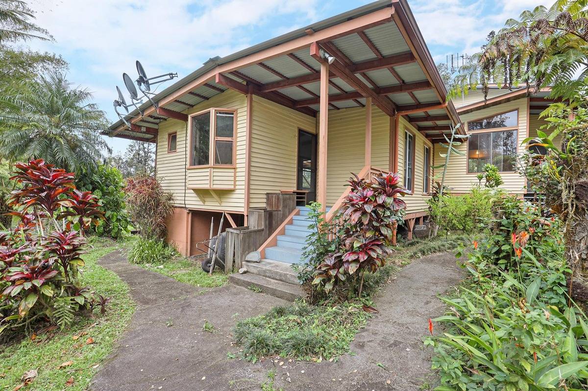 16-1585 Hopue Road, Unit 2 Mountain View, HI 96771 - Photo 4 of 29 front view of a house with a yard