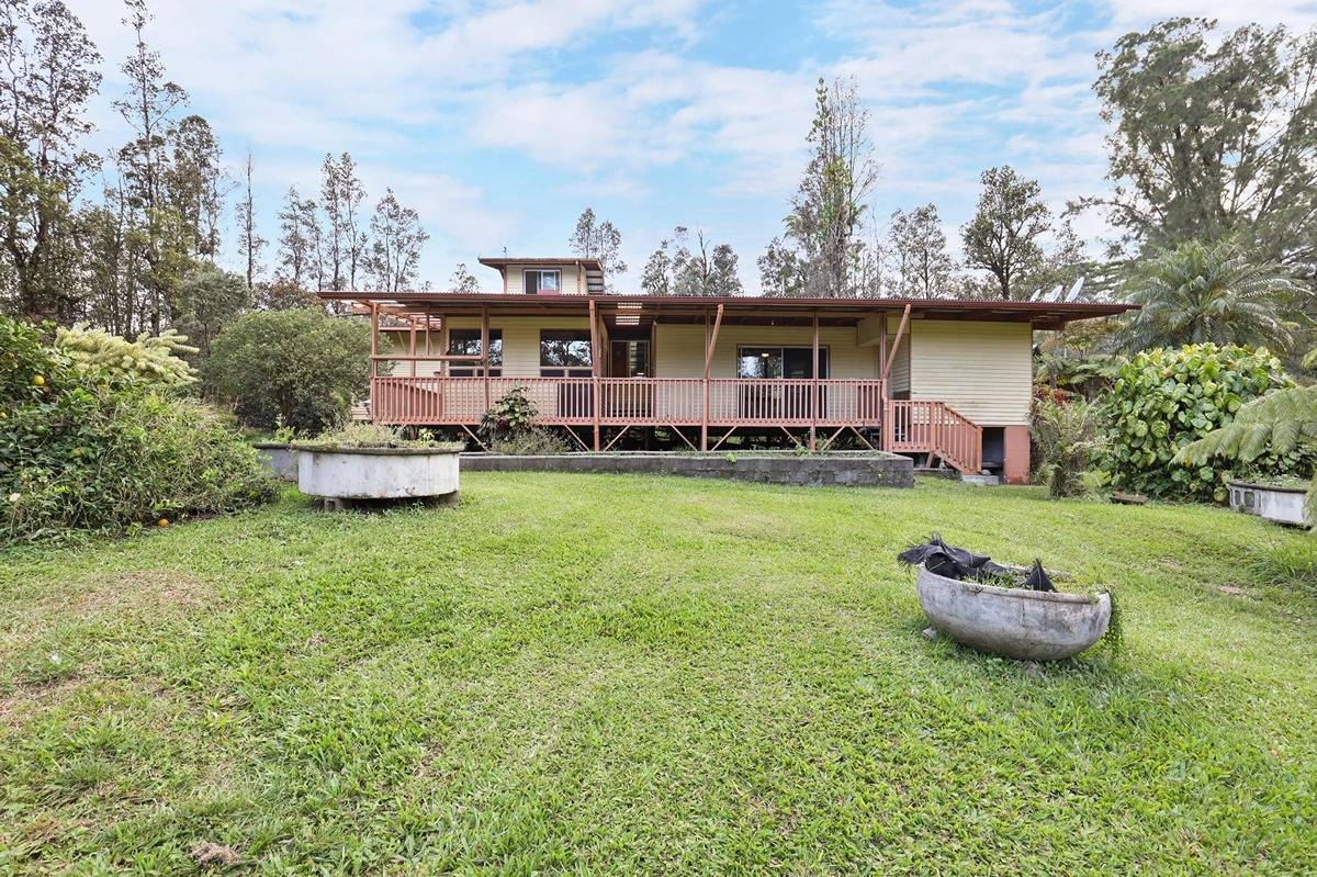 16-1585 Hopue Road, Unit 2 Mountain View, HI 96771 - Photo 6 of 29 a house view with a garden space