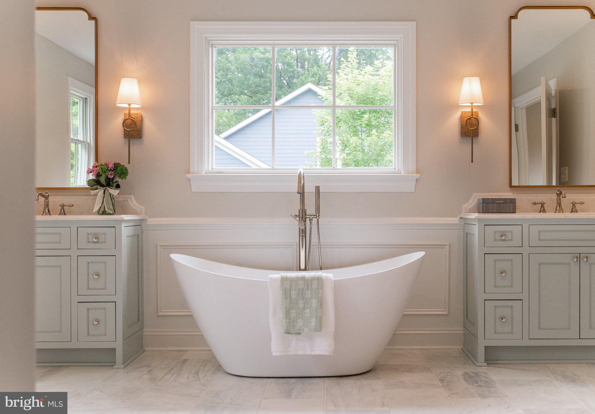 205 MacArthur Road Alexandria, VA 22305 - Photo 20 of 23 a white bath tub sitting in a bathroom
