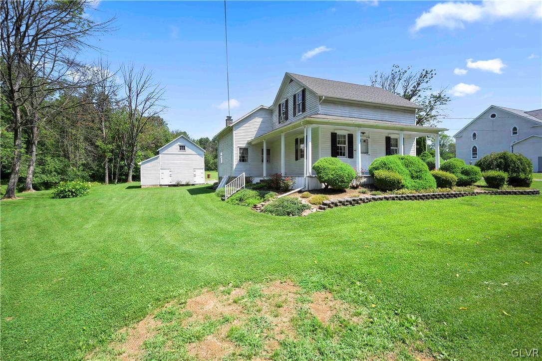 465 Belfast Road Nazareth, PA 18064 - Photo 29 of 32 a front view of house with yard and green space