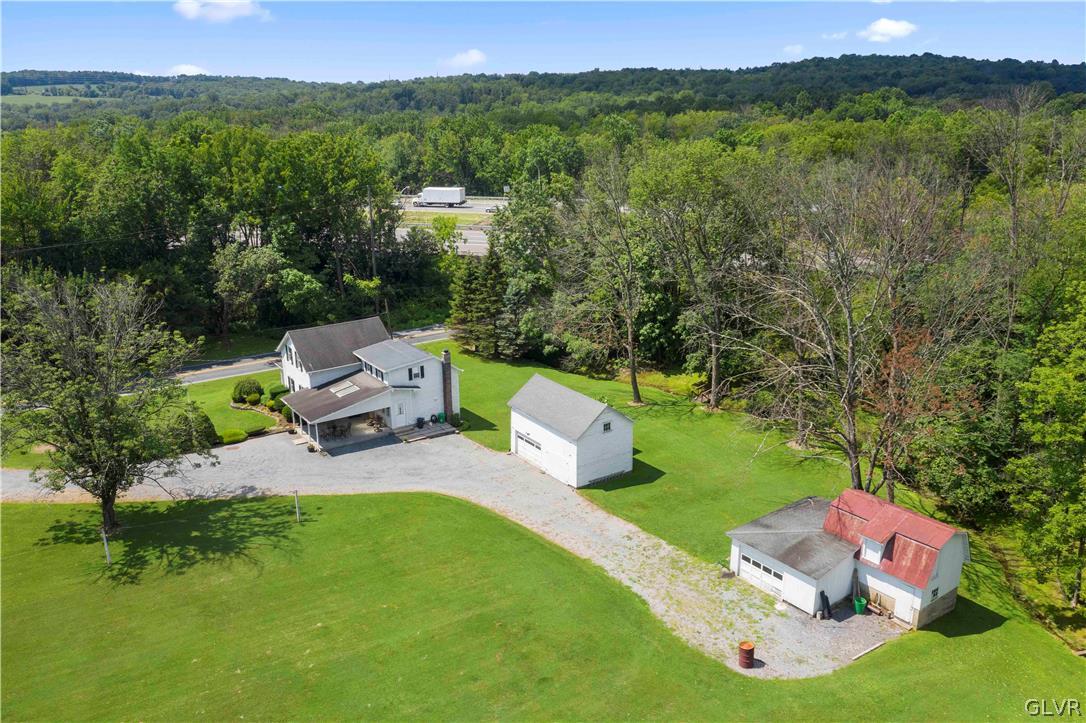 465 Belfast Road Nazareth, PA 18064 - Photo 4 of 32 a view of a lake with a yard and mountain
