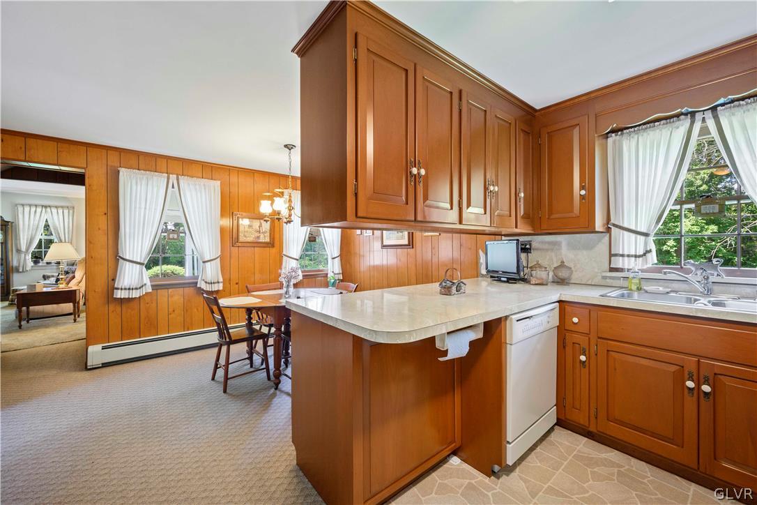 465 Belfast Road Nazareth, PA 18064 - Photo 7 of 32 a kitchen with a sink stove and chairs