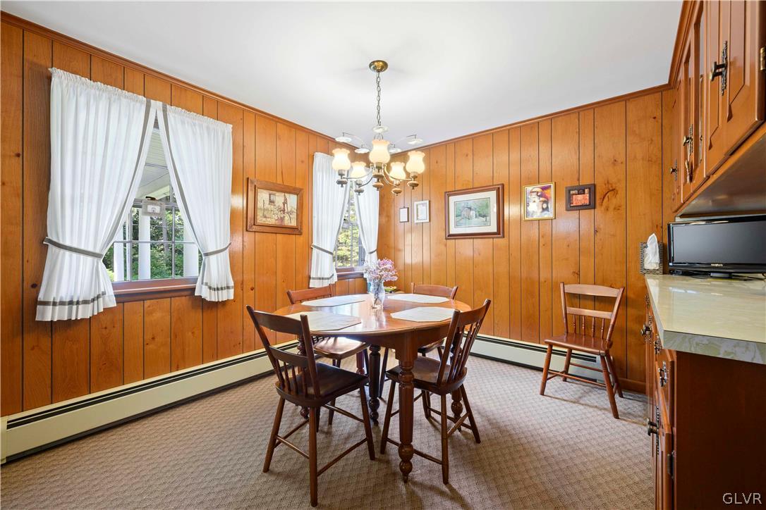 465 Belfast Road Nazareth, PA 18064 - Photo 8 of 32 a dining room with furniture window wooden floor and a chandelier