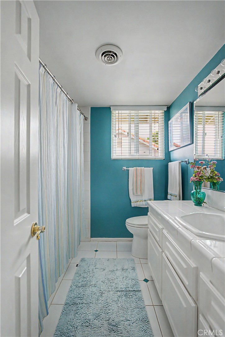 22671 Town Crier Road Calabasas, CA 91302 - Photo 35 of 35 a bathroom with a sink a toilet and shower