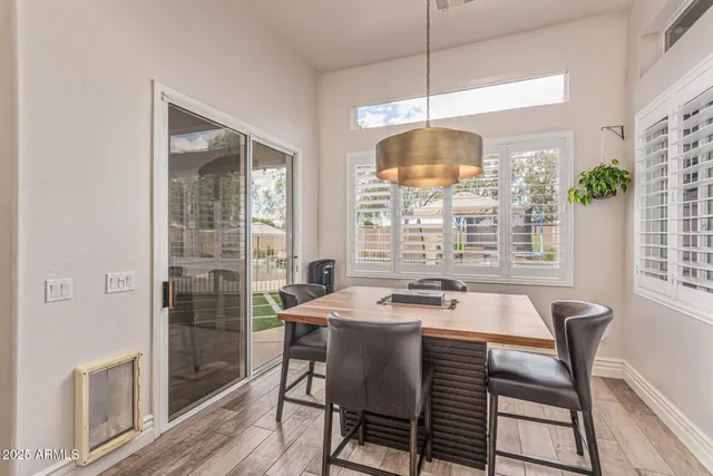 a view of walk in closet with clothes