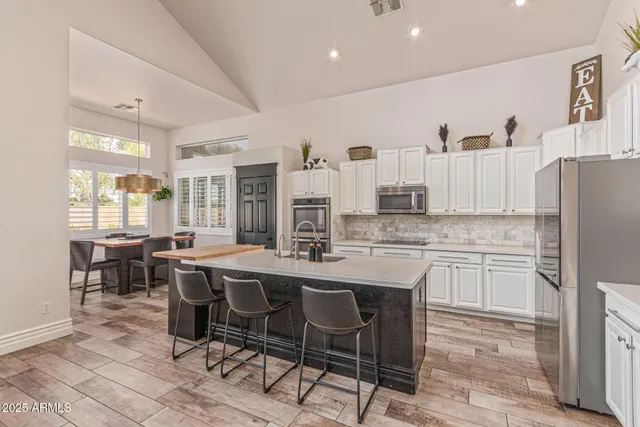 a bedroom with furniture and a baby crib