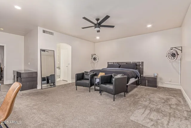 a view of a porch with chairs and a patio