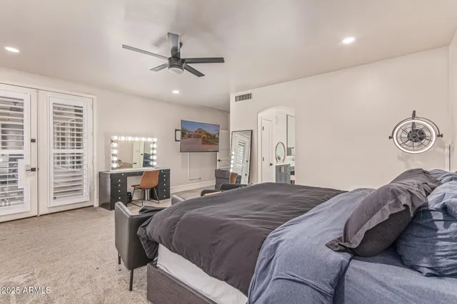 a dining room with furniture a chandelier and a dining table
