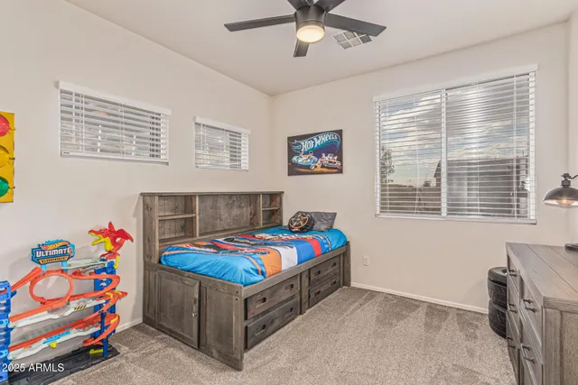 a view of a house with a swimming pool and a yard