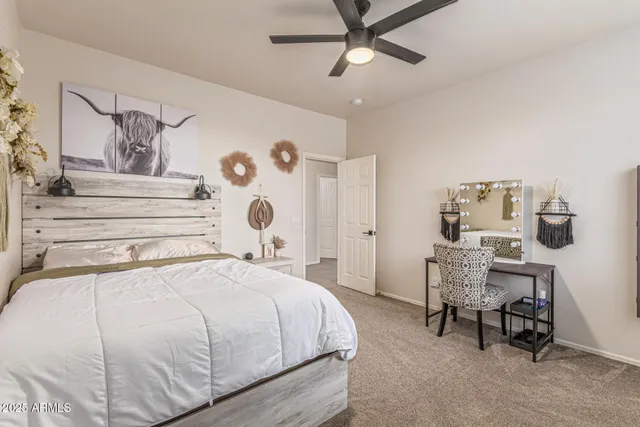 a view of a tables and chairs under an umbrella in backyard