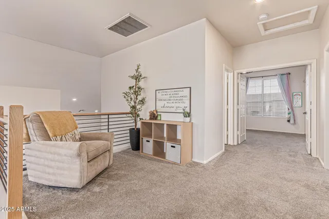 an aerial view of a house with table and chairs