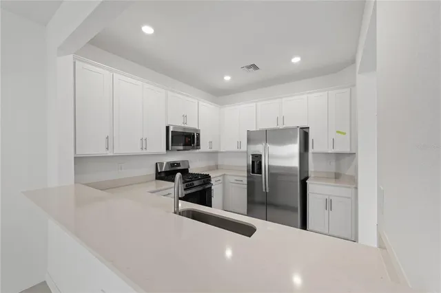 a view of a kitchen with a sink