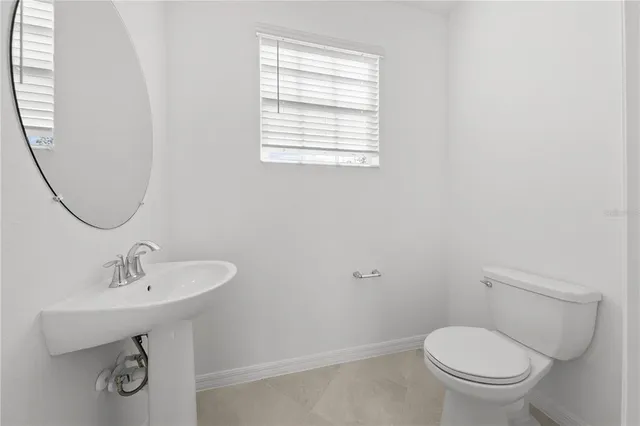 a bathroom with a sink a vanity and a bathtub