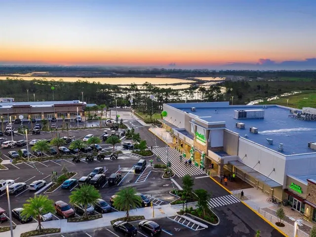 an aerial view of a house with garden space and street view