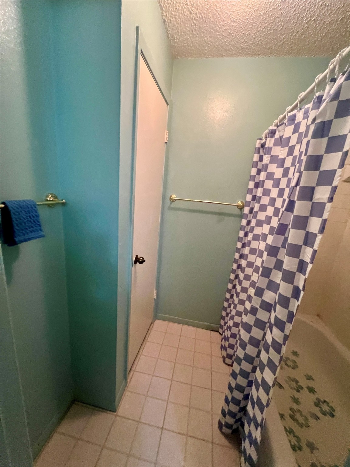 307 Jill Street Conroe, TX 77303 - Photo 12 of 20 a bathroom with a bathtub and shower