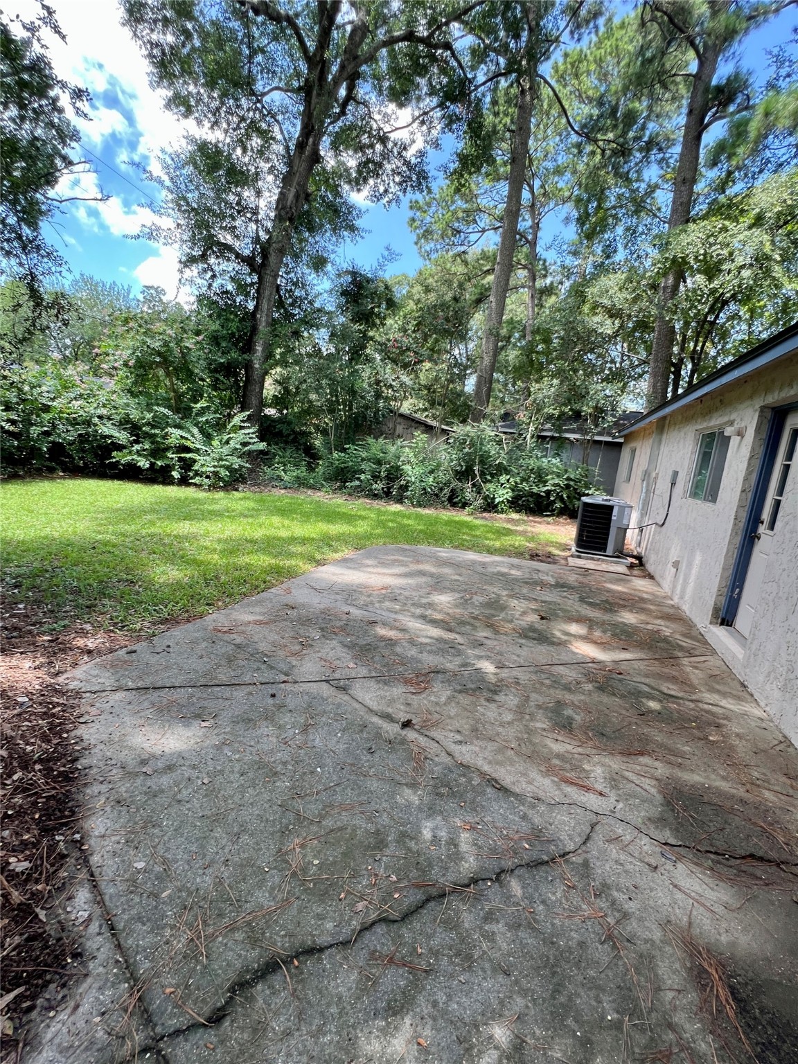 307 Jill Street Conroe, TX 77303 - Photo 18 of 20 a view of outdoor space with deck and yard