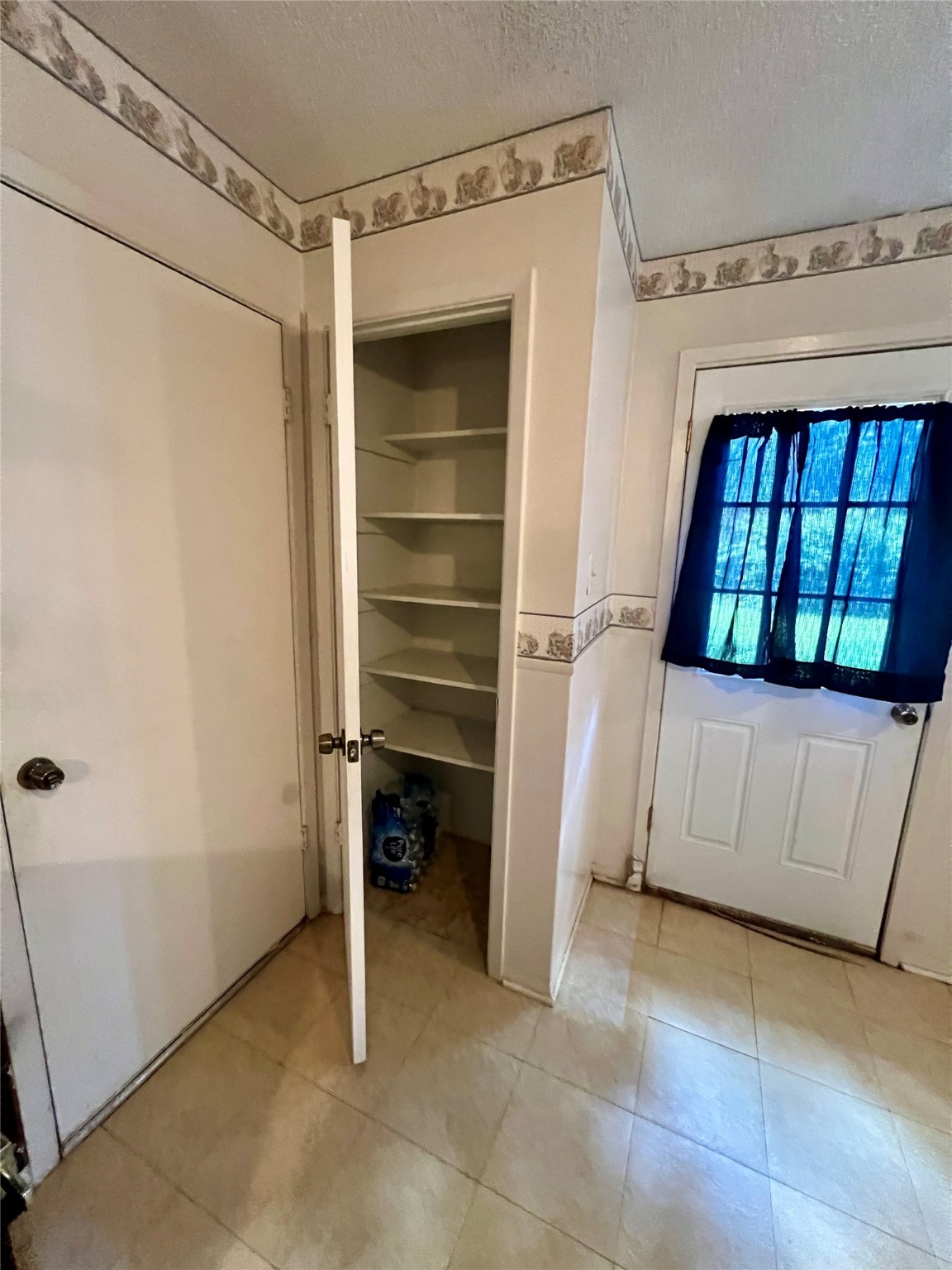 307 Jill Street Conroe, TX 77303 - Photo 5 of 20 a view of a utility room with a window