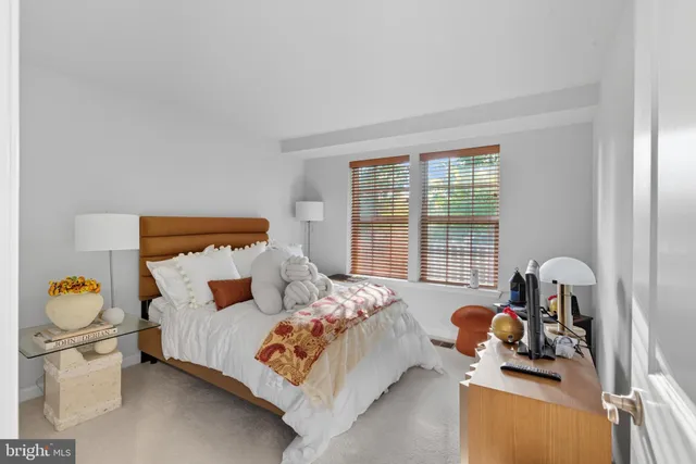 a bedroom with bed and window