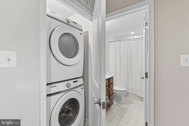 a view of a hallway with washer and dryer