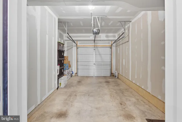 a view of empty room with white walls