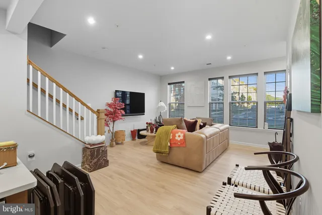 a living room with furniture fireplace and a flat screen tv