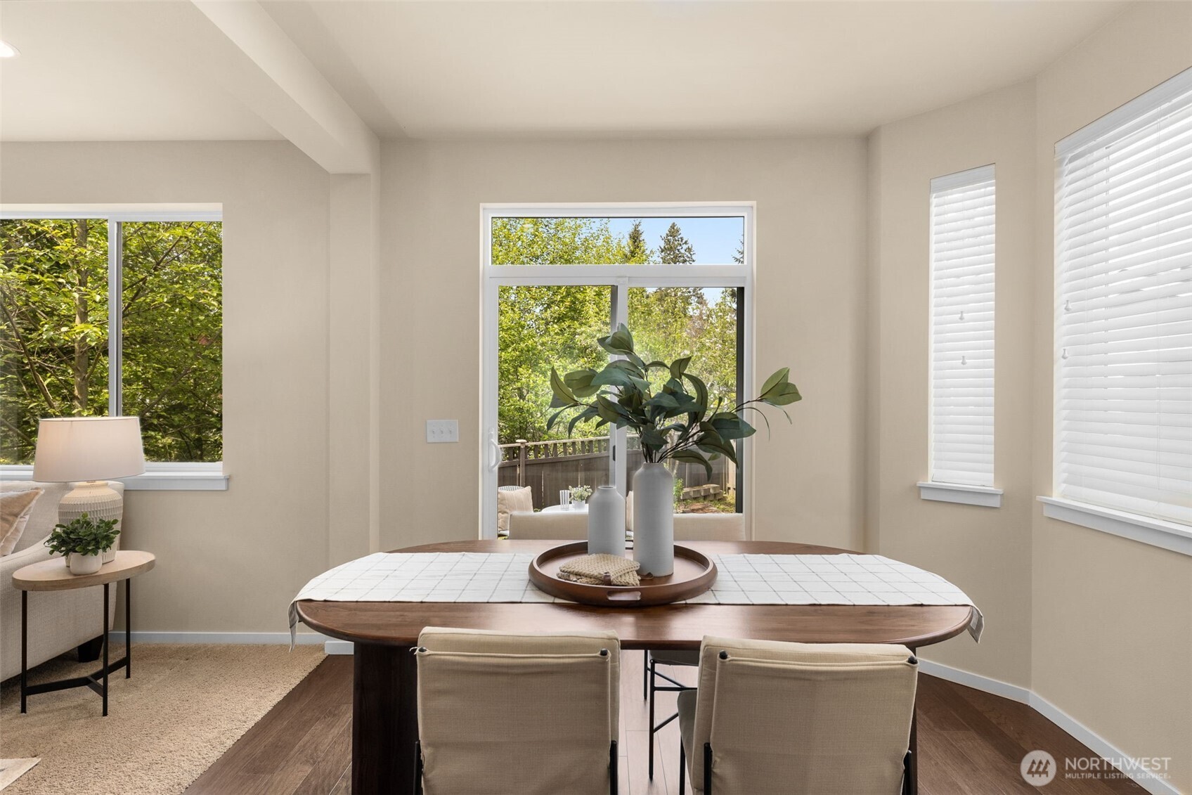 18525 115th Place Southeast Renton, WA 98055 - Photo 11 of 29 a view of a dining room with furniture a potted plant and a window