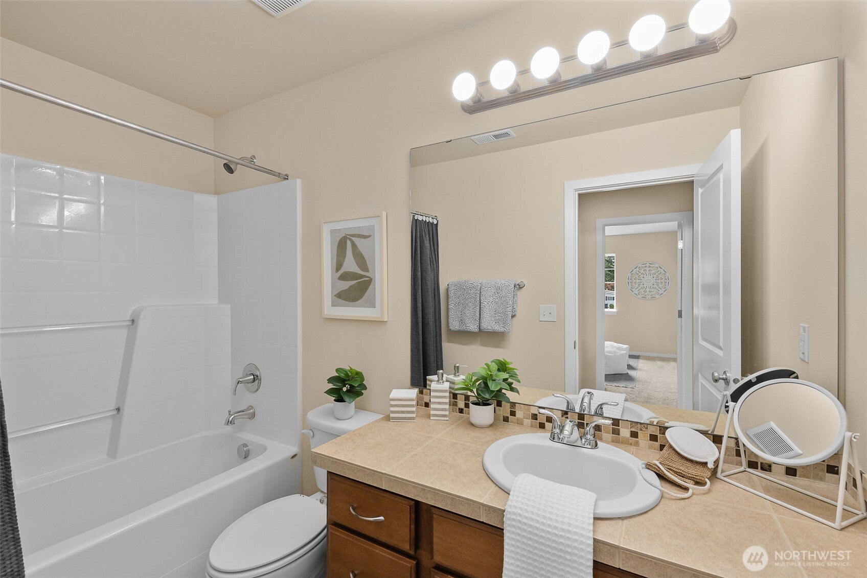 18525 115th Place Southeast Renton, WA 98055 - Photo 22 of 29 a bathroom with a granite countertop sink mirror toilet and bathtub