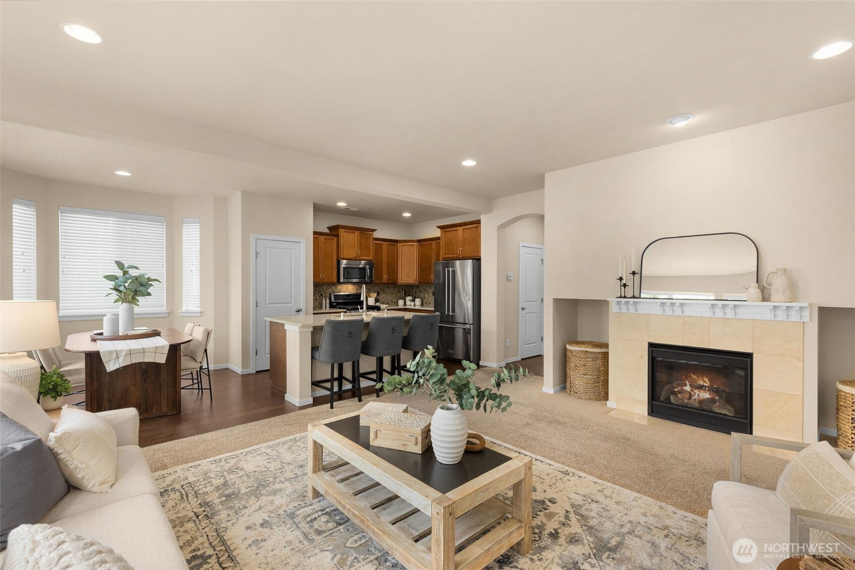 18525 115th Place Southeast Renton, WA 98055 - Photo 5 of 29 a living room with furniture a fireplace and a kitchen view