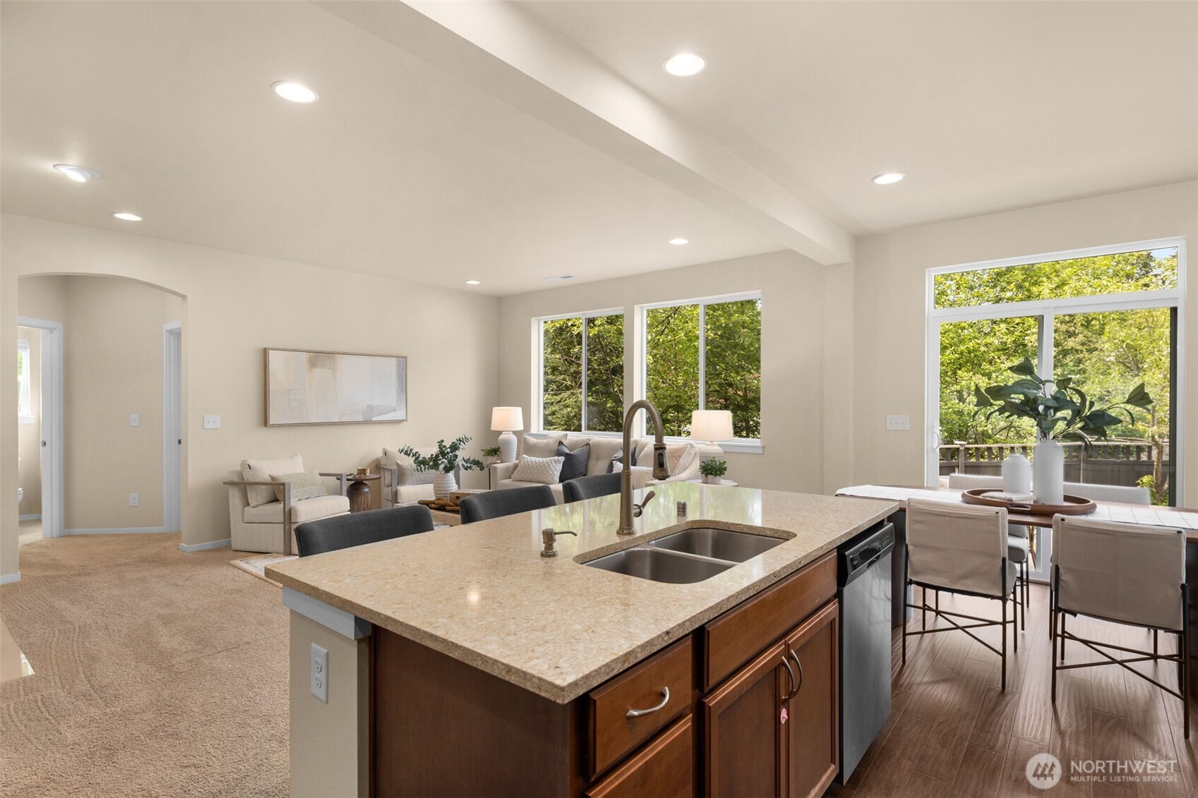 18525 115th Place Southeast Renton, WA 98055 - Photo 6 of 29 a kitchen with a stove a sink a dining table and chairs