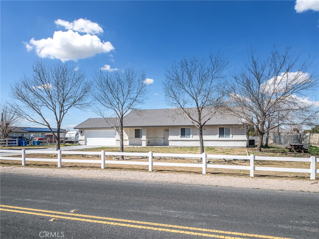 14266 Kiowa Road Apple Valley, CA 92307 - Photo 2 of 27 Classic ranch-style design with clean lines and expansive frontage, perfectly complementing the open High Desert surroundings.