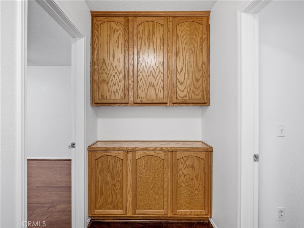 14266 Kiowa Road Apple Valley, CA 92307 - Photo 21 of 27 Enjoy added organization with a built-in wood linen cabinet — perfect for towels and essentials.