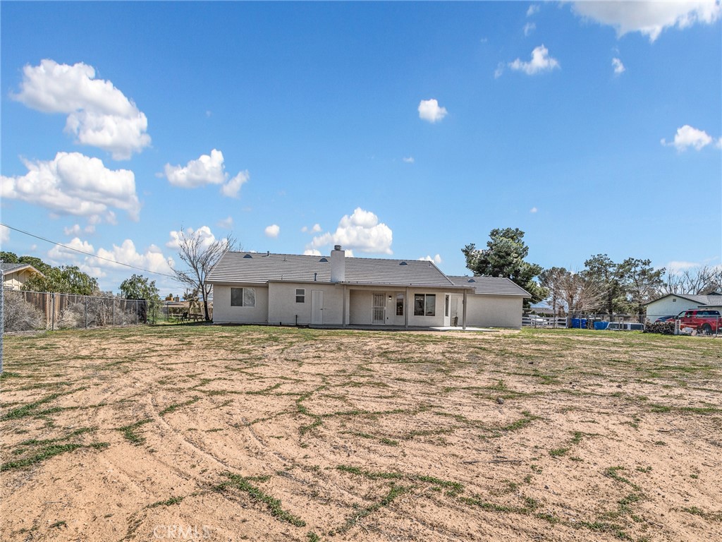 14266 Kiowa Road Apple Valley, CA 92307 - Photo 23 of 27 Spacious, flat acre offering endless possibilities — room for RVs, toys, animals, or future additions.