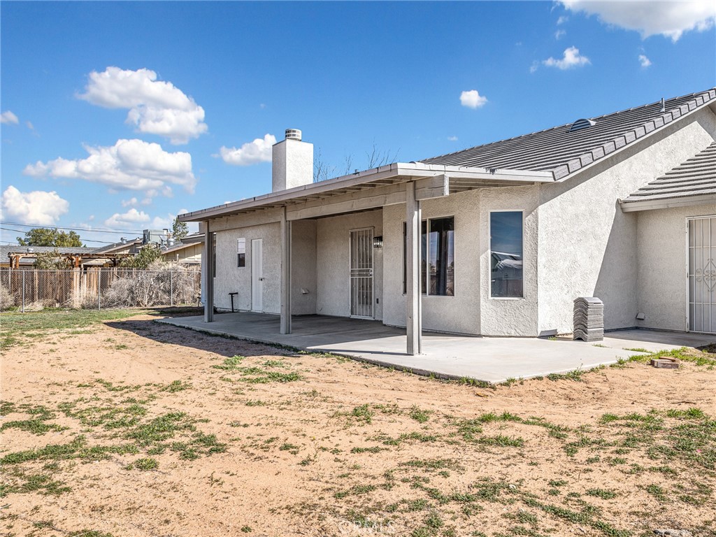 14266 Kiowa Road Apple Valley, CA 92307 - Photo 24 of 27 Covered back patio perfect for relaxing or entertaining while enjoying peaceful rural surroundings.