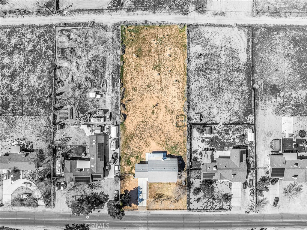 14266 Kiowa Road Apple Valley, CA 92307 - Photo 27 of 27 Aerial view of the surrounding neighborhood showcasing spacious lots and the peaceful rural setting of Apple Valley Ranchos.
