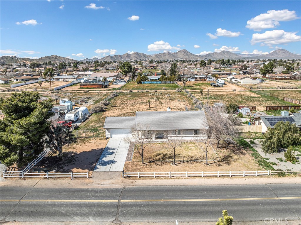 14266 Kiowa Road Apple Valley, CA 92307 - Photo 8 of 27 Impressive aerial view showcasing the fully fenced, flat 1-acre lot with abundant usable space and privacy.