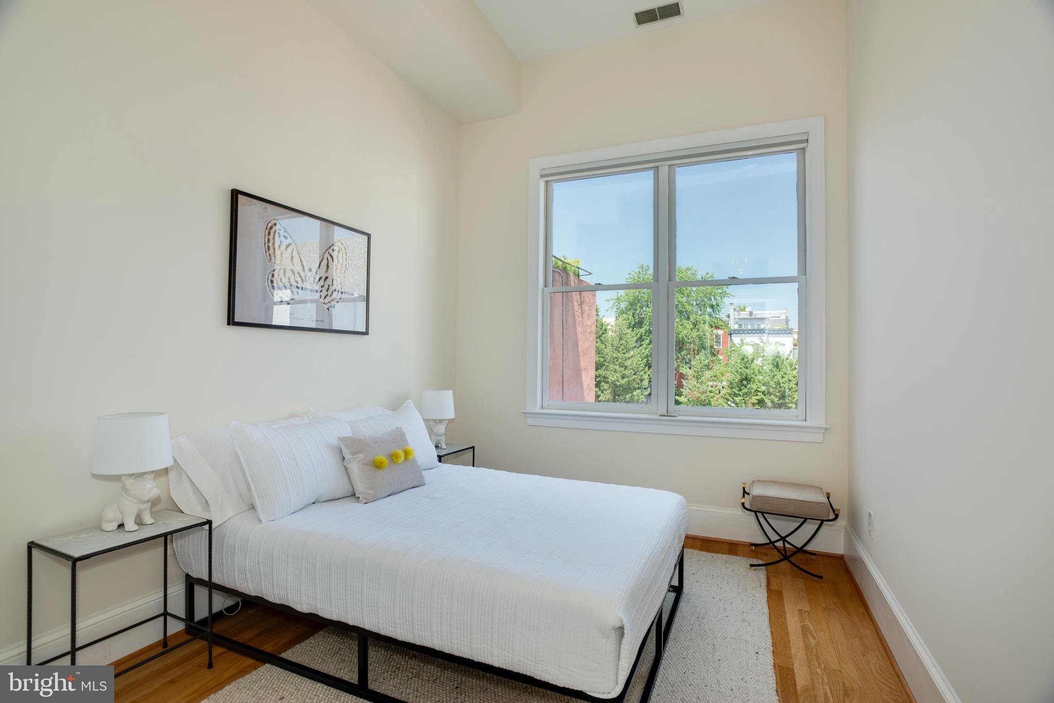 1515 P Street Northwest, Unit 3 Washington, DC 20005 - Photo 12 of 22 Guest Bedroom offers automatic black out shades