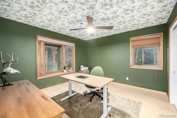 a workspace with furniture and a window