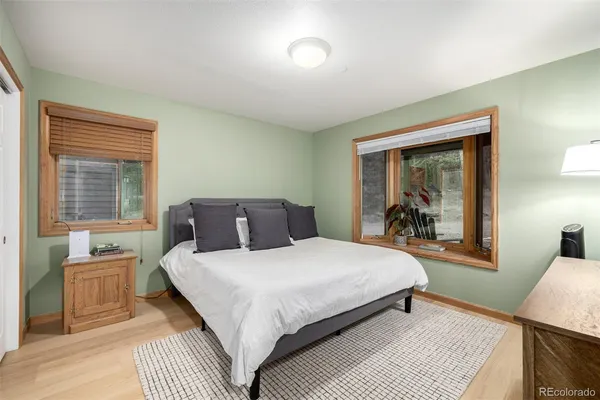 a bedroom with a large bed and a window